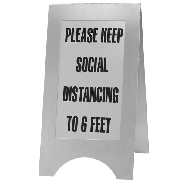 A Cal-Mil stainless steel 2-sided social distancing sign on a counter.