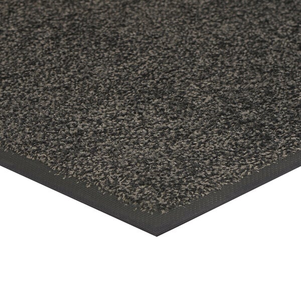A black rubber-backed entrance mat with a gray slate surface.