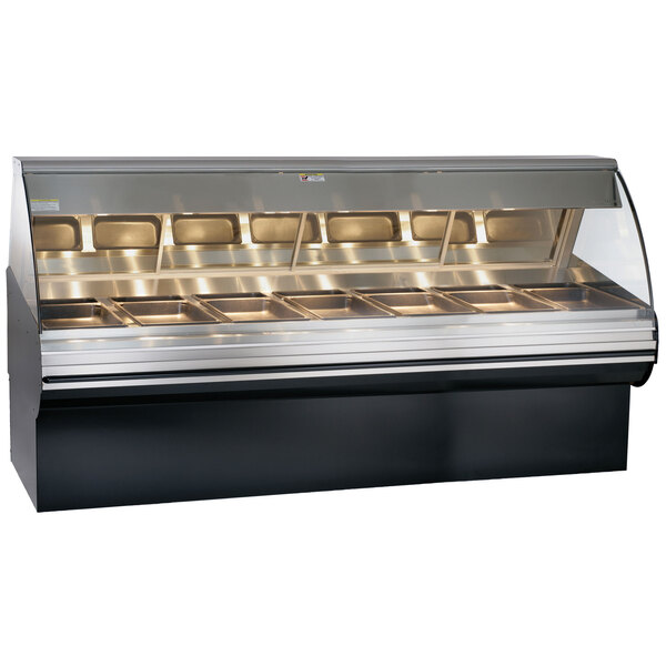 A black Alto-Shaam heated display case with curved glass over three food trays.