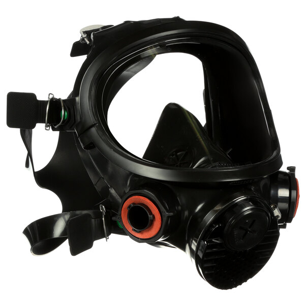 A black full face respirator with orange air valve.