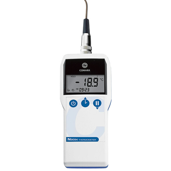 A white Comark N9094 Ultimate Thermocouple Thermometer with a screen and buttons.