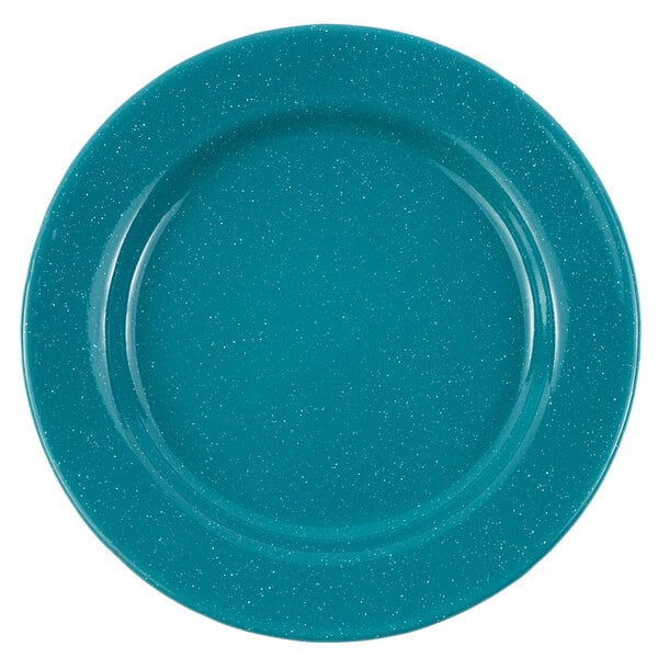 A turquoise Crow Canyon Home enamelware plate with a speckled surface and blue rim.