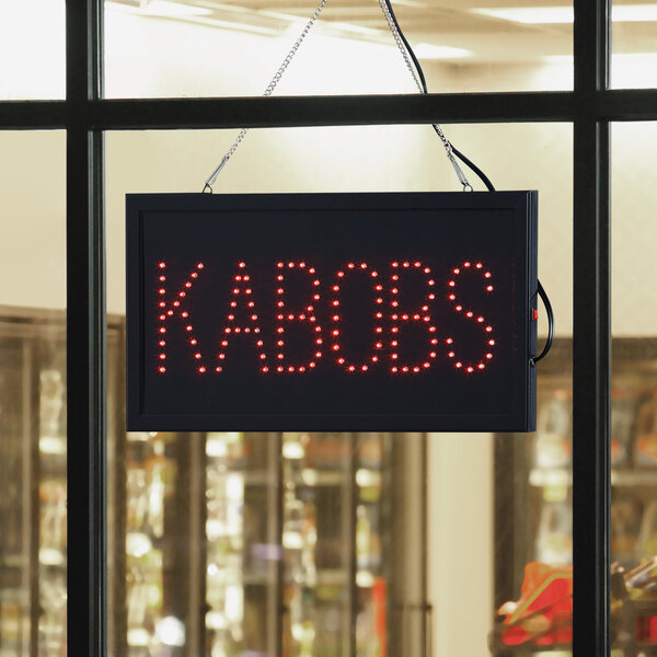A rectangular LED sign that says "Kabobs" in red lights.
