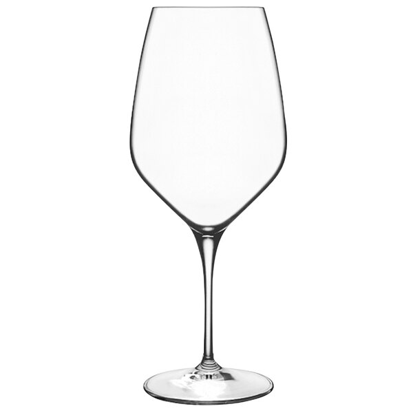 A close-up of a Luigi Bormioli Atelier Cabernet wine glass with a stem.