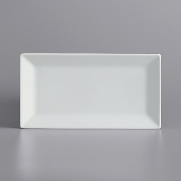 A white rectangular porcelain platter with a white border.
