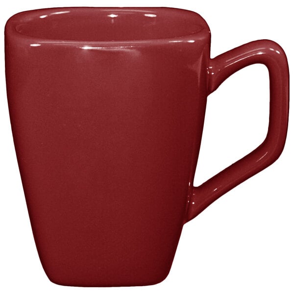 An International Tableware rhubarb porcelain tall cup with a handle in red.