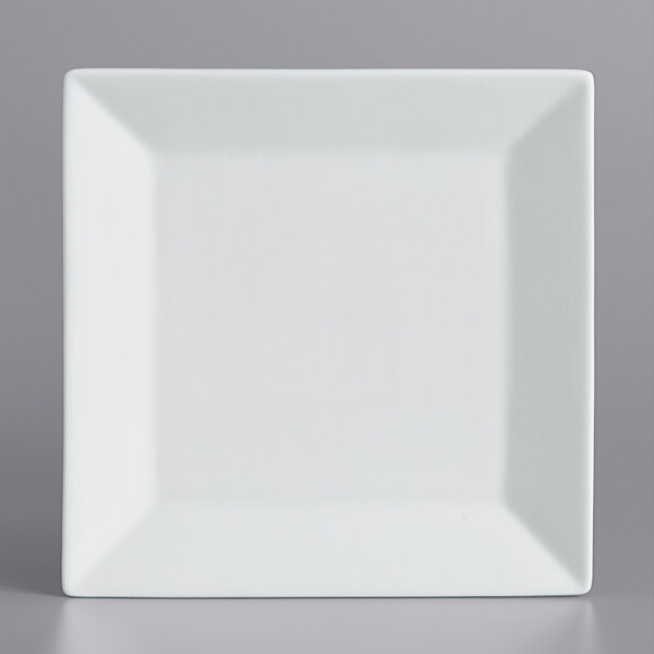 A white square plate with a wide rim.