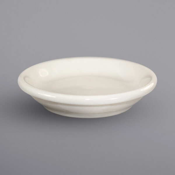 An ivory porcelain butter dish with a rolled edge on a white background.