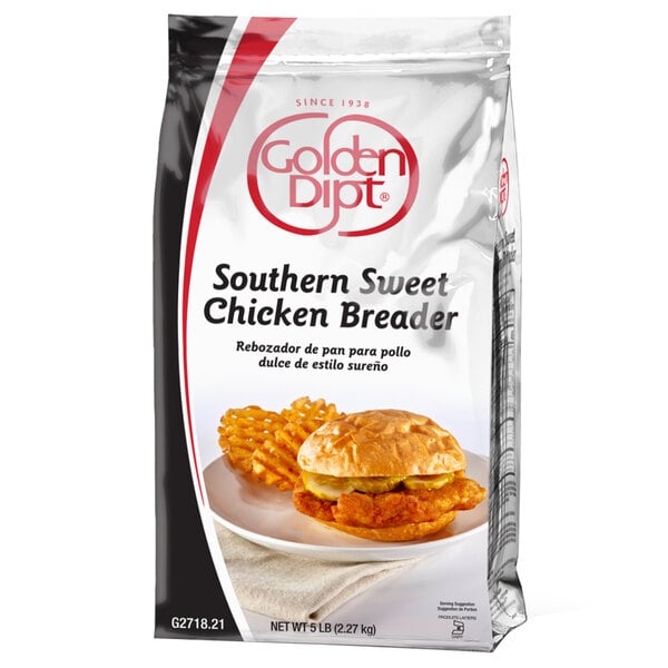 A bag of Golden Dipt Southern Sweet Chicken Breader with a chicken sandwich and fries.