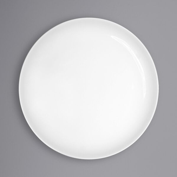 A white International Tableware Torino porcelain plate with a white rim.