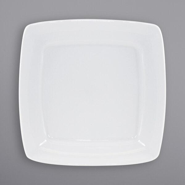 A white square International Tableware porcelain plate with a wide rim.