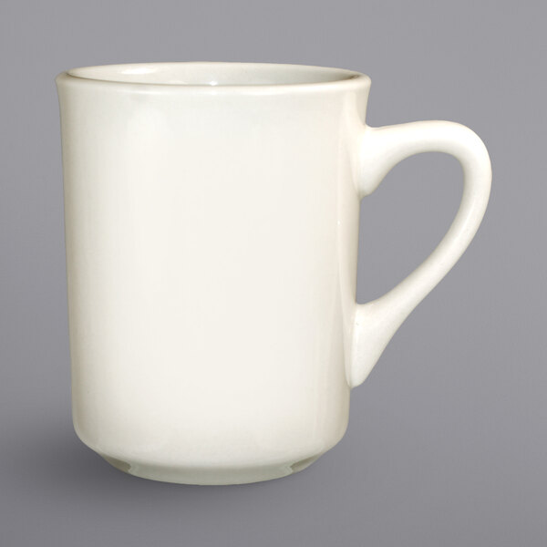 An International Tableware ivory porcelain mug with a white handle.
