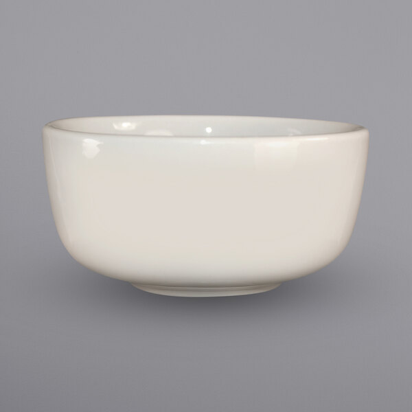 An ivory stoneware bowl on a white background.