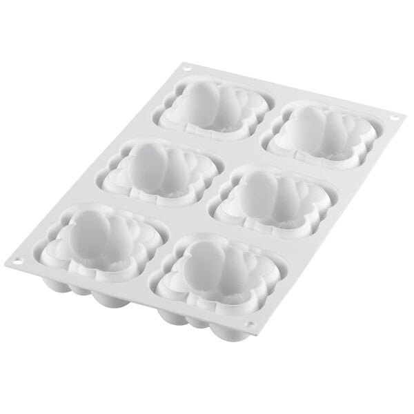 A white silicone baking mold with six rectangular compartments.