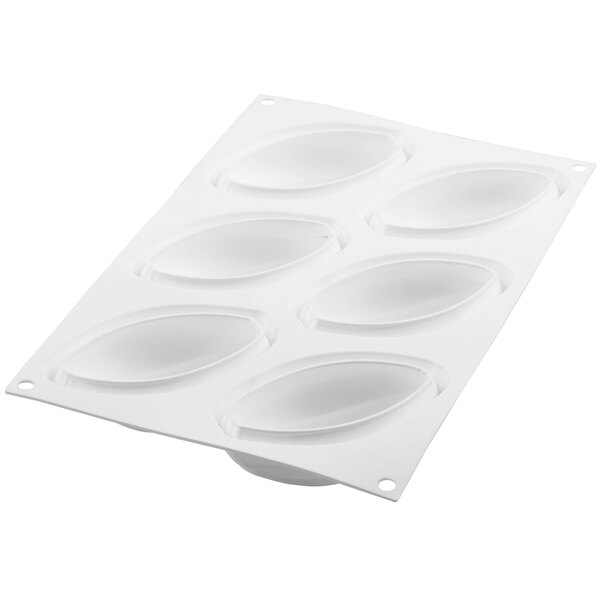 A white plastic Silikomart baking mold with oval-shaped compartments.