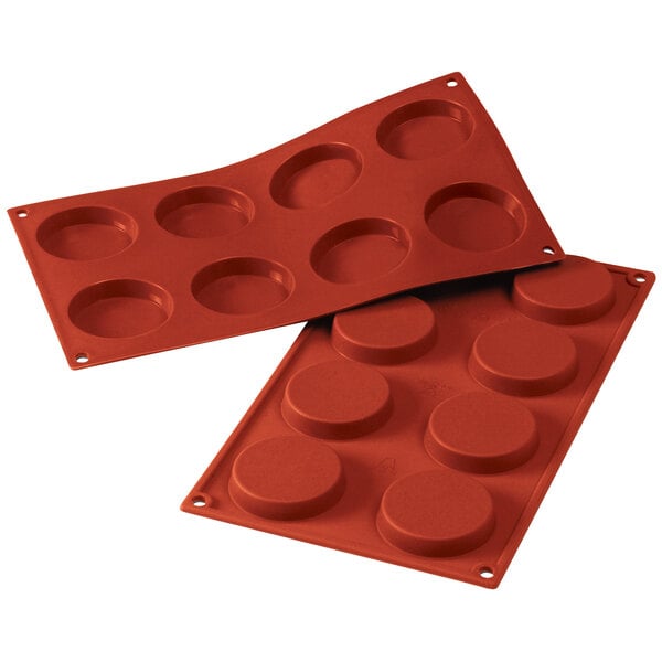 A close-up of a Silikomart silicone baking mold with 8 compartments.