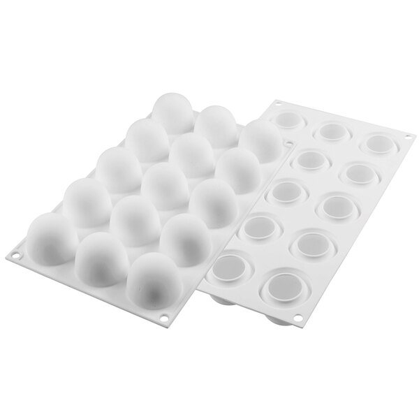 A white Silikomart silicone baking mold with egg-shaped cavities.