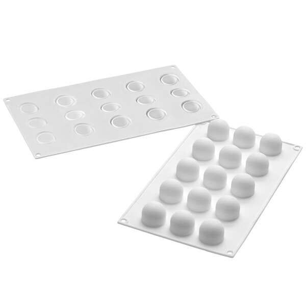 A white silicone baking mold with rounded cavities.