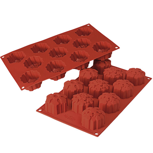 A red Silikomart silicone mold with snowflake-shaped cavities.