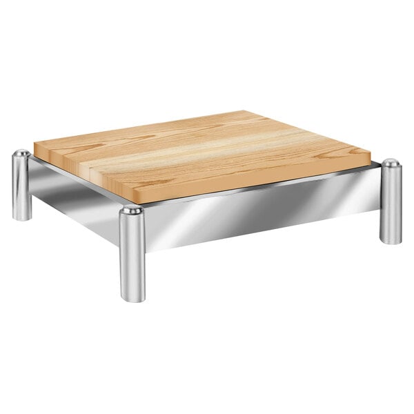 A wooden butcher block riser with a stainless steel frame.