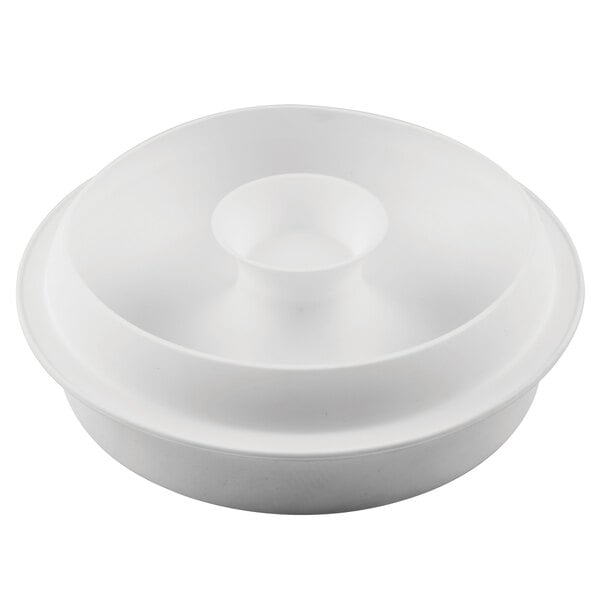 A white bowl with a lid on a white surface.