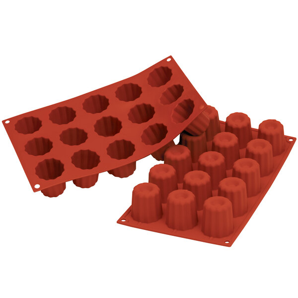 A red Silikomart silicone baking mold with 15 square cavities.