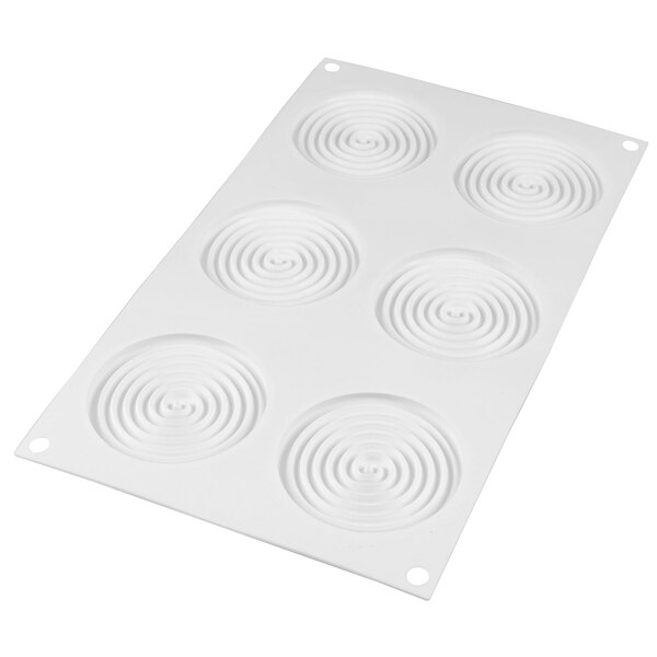 A white silicone baking mold with spiral designs.