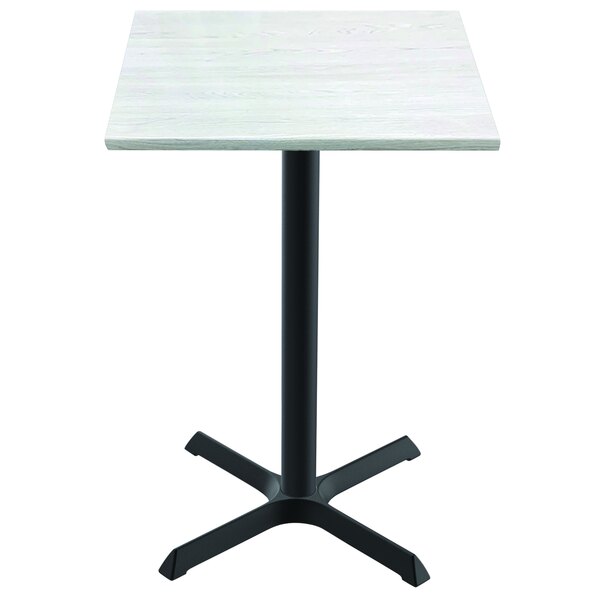 A white square table with a white ash wood laminate top and a black cross base.