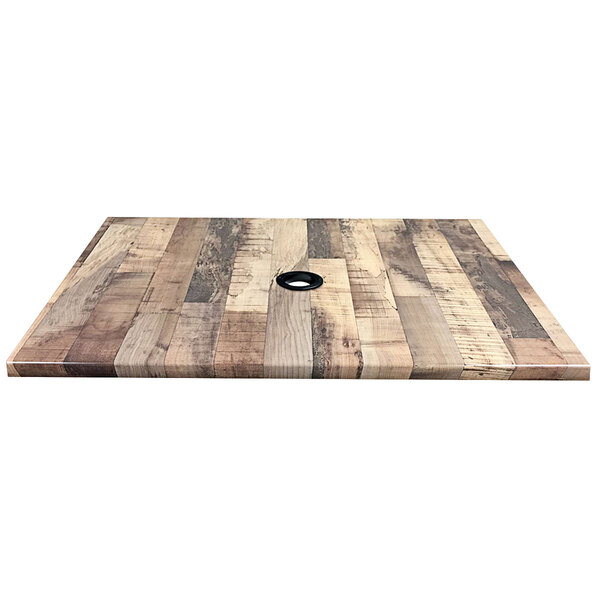 A wooden table top with a hole in the center.