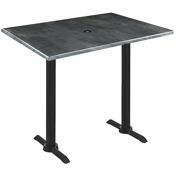A Holland Bar Stool black steel wood laminate bar height table with a black metal base.
