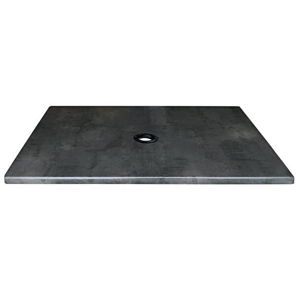 A black square metal table top with a hole in the center.