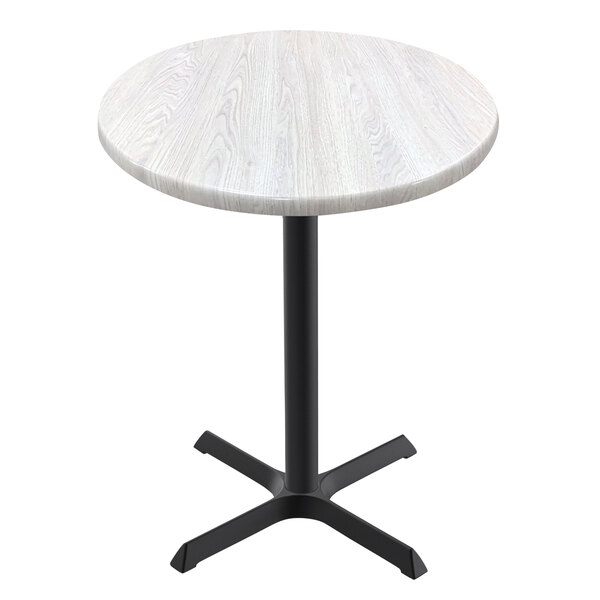 A white round Holland Bar Stool EnduroTop table with a white ash wood surface and cross base.