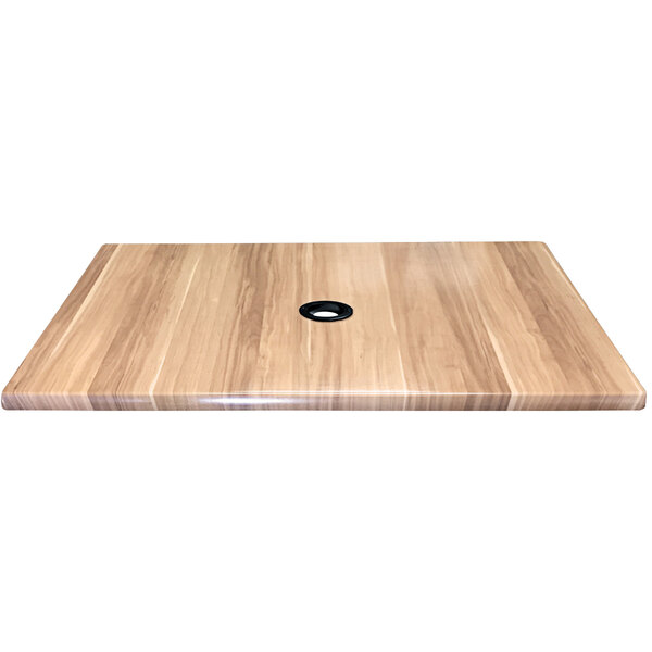 A wood table top with a hole in the center.