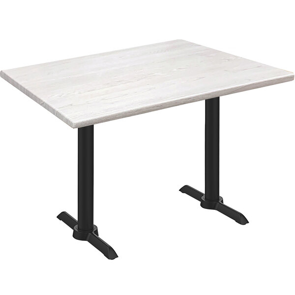 A white Holland Bar Stool EnduroTop table with white ash wood top and black end column base.