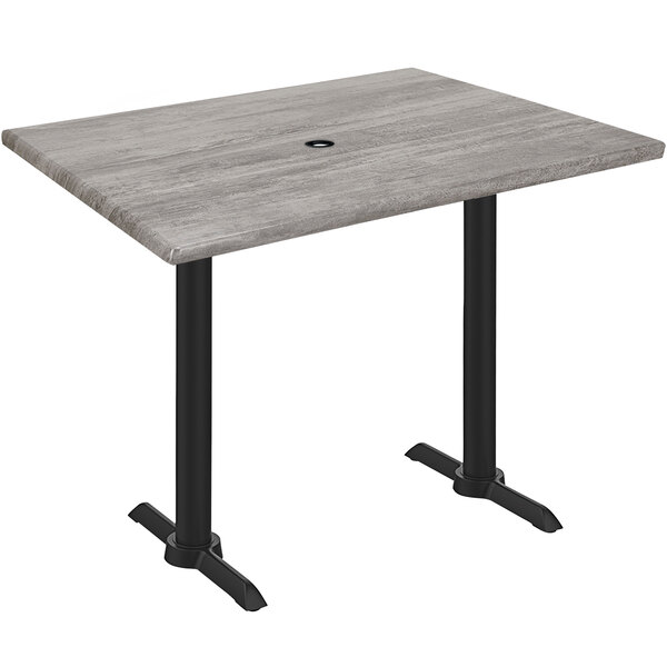 A Holland Bar Stool EnduroTop counter height table with a Greystone wood laminate top and black end column base.