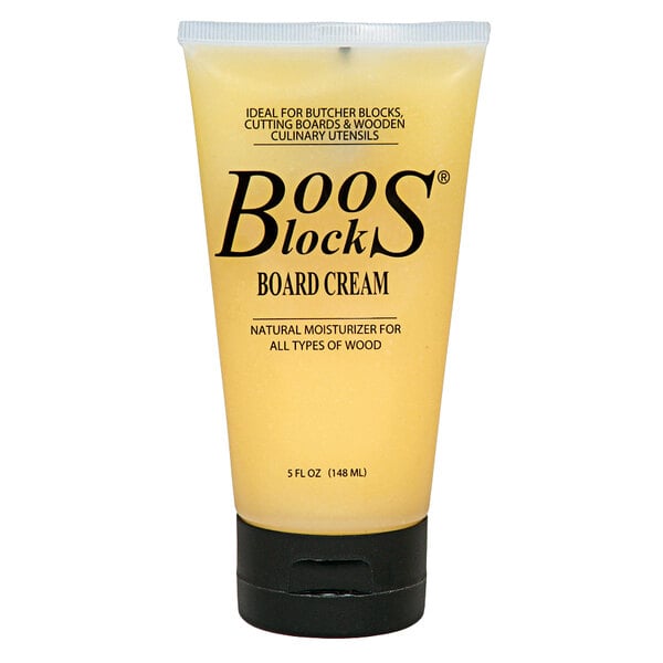 A yellow tube of John Boos Block Board Cream with a black cap.