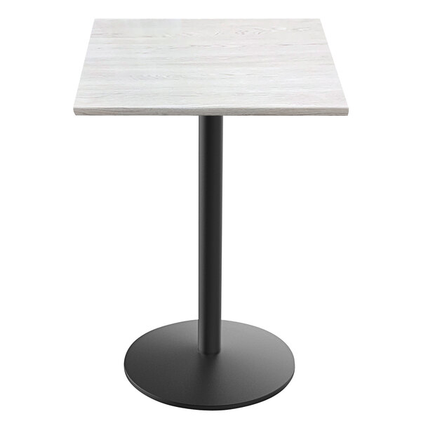 A white square Holland Bar Stool EnduroTop table with a white top and black round base.