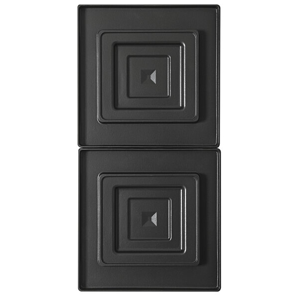 Two black metal square trays with square designs.