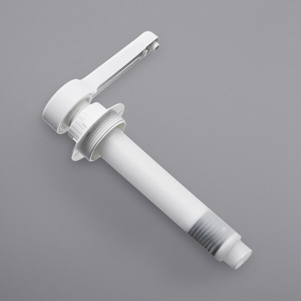 A white plastic pump with a white plastic tube and screw on top.
