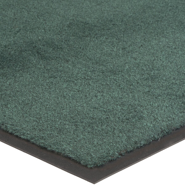 A green carpet mat with a black border.