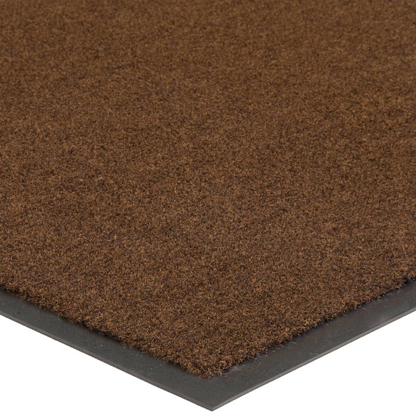 A close up of a Lavex chocolate brown Olefin entrance mat with a black border.