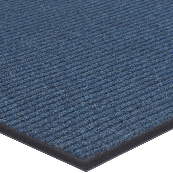 A close up of a blue Lavex Needle Rib indoor entrance mat with a black border.