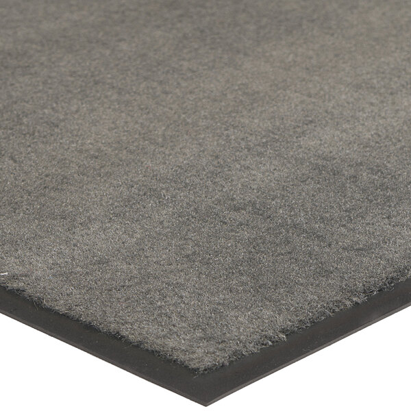 A Lavex charcoal gray carpet entrance mat with a black border.