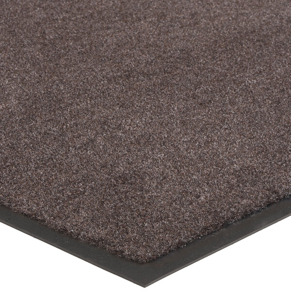 A brown carpet mat with a black border.