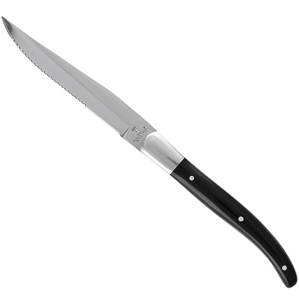 A Fortessa steak knife with a black handle and full tang silver blade.
