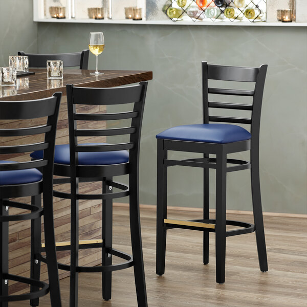 Lancaster Table & Seating Black Ladder Back Bar Height Chair with Navy Padded Seat