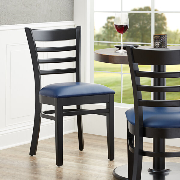 Lancaster Table & Seating Black Finish Wooden Ladder Back Chair with 2 1/2" Navy Padded Seat