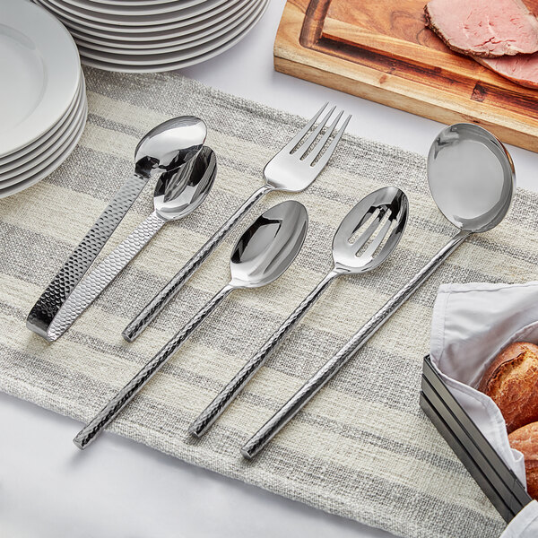 A Carlisle Terra stainless steel spoon and fork set on a table