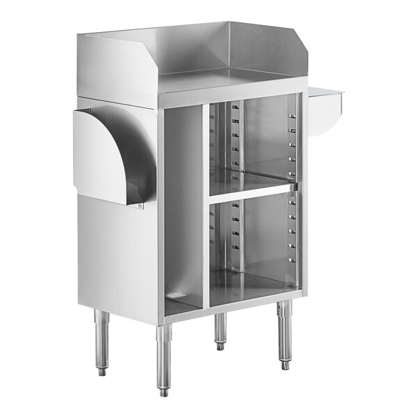 A stainless steel station with a raised back and sides, open shelving in the center, and curved holders on each side, supported by four sturdy legs.