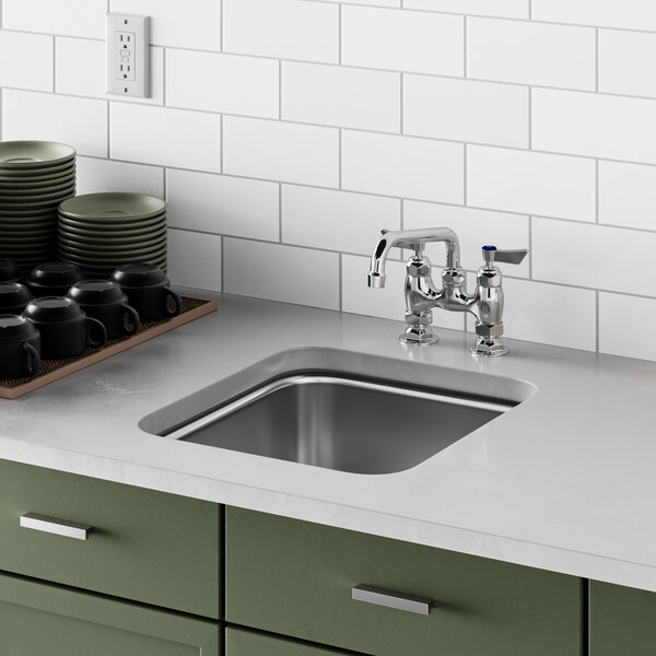 A close up of a Waterloo stainless steel undermount sink.